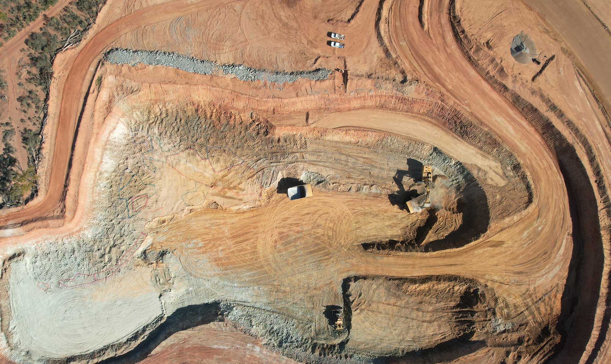 Birds-eye-view drone shot of an open-pit mine.