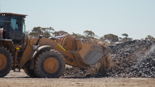 Loader with MMS logo. Side view